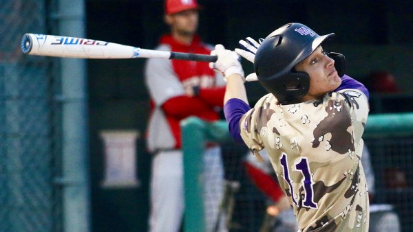 Lemoore's Justin Holaday watches a base hit soar off his bat during Friday's  10-inning, 6-5 victory over visiting Kerman on the team's Military Appreciation Night.